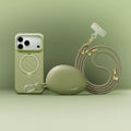 Sage green TORRAS Ostand Q3 Silicone Wind Limited iPhone 17 Pro case with magnetic stand, pebble charger, and lanyard.