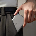 Sleek grey TORRAS MiniMag power bank, 10k mAh, fits easily in pocket.