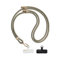 TORRAS LoopGo Flex khaki crossbody phone lanyard with gold hardware & 'Never Stop' attachment pads.