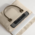 TORRAS Ostand case for iPad Pro 13 inch M4 in beige sleeve with leather handle.