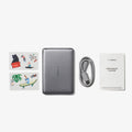 TORRAS MiniMag Pro 5k mAh power bank in sleek grey, with cable, manual, and stickers.