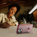 TORRAS Ostand Q3 Air case for iPhone 15 Pro Max, transparent pink, rose gold ring.