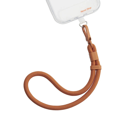 TORRAS tan braided rope wrist phone lanyard with adjustable clasp and 'Never Stop' case.