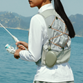 TORRAS FlexLine Pebble 10k mAh power bank with integrated hook, clipped to fishing vest outdoors.