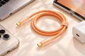 TORRAS Ice Gold cable beside compatible USB-C devices; devices and charger not included